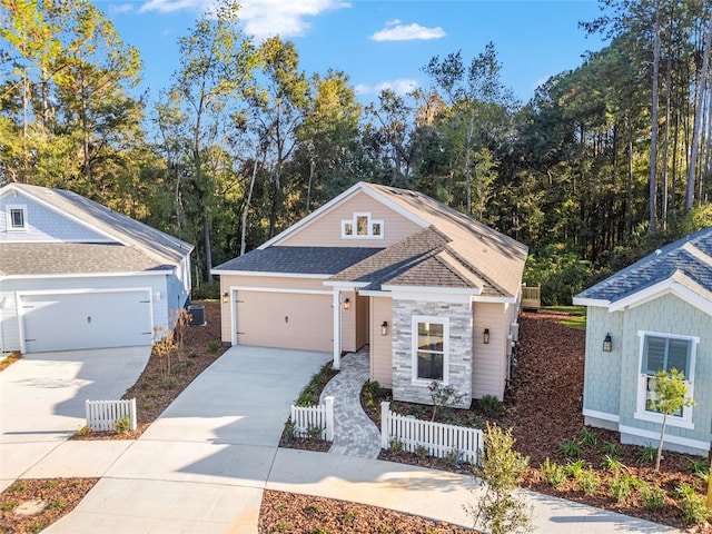 view of front facade featuring central AC unit and a garage