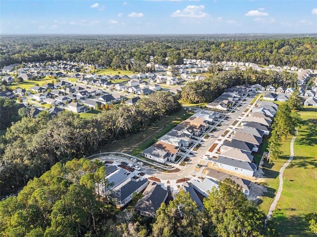 1023 NW 132nd Blvd, Newberry, FL 32669 - aerial view of property and surrounding area featuring nearby suburban area and a heavily wooded area
