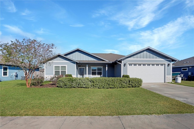 view of front of property with a garage and a front yard