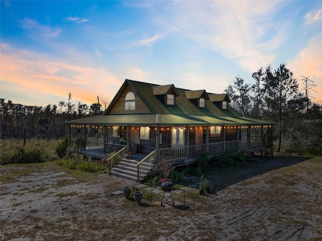 7550 SW 127th Ct, Cedar Key, FL 32625 - country-style home with covered porch and metal roof