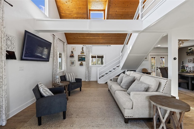 living room with hardwood / wood-style floors, high vaulted ceiling, and wood ceiling