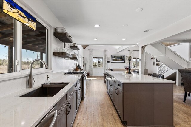 7550 SW 127th Ct, Cedar Key, FL 32625 - kitchen featuring a sink, stainless steel appliances, open shelves, recessed lighting, and light wood finished floors