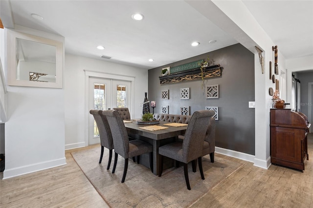 dining room featuring light hardwood / wood-style floors