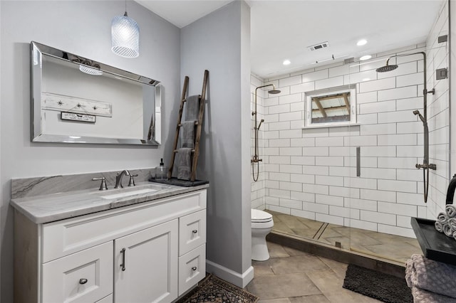 bathroom with tile patterned flooring, vanity, toilet, and an enclosed shower