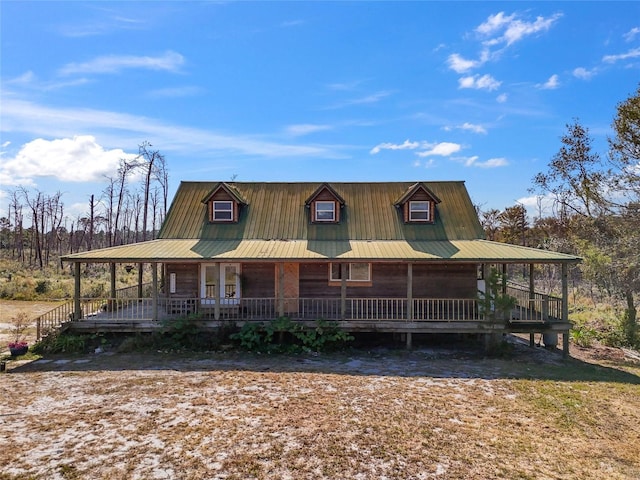 7550 SW 127th Ct, Cedar Key, FL 32625 - country-style home featuring covered porch and metal roof