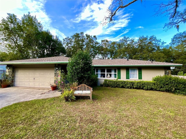 single story home with a garage and a front lawn