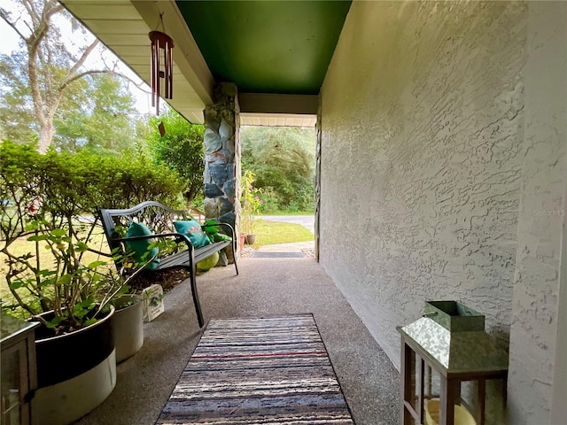 view of patio featuring a porch