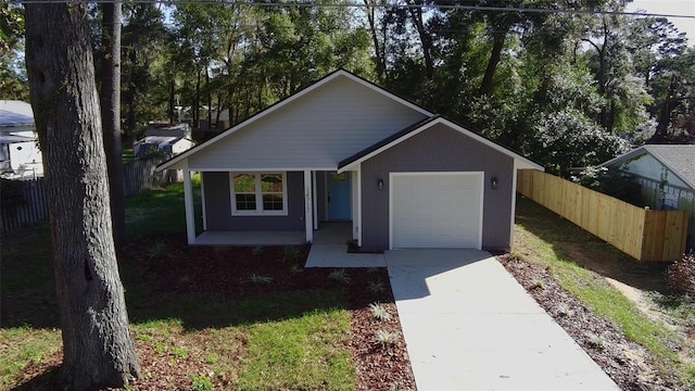 view of front of house featuring a porch and a garage