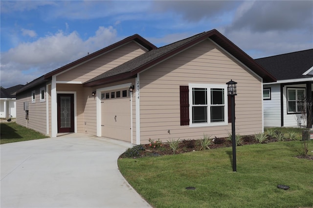 single story home featuring a front lawn and a garage