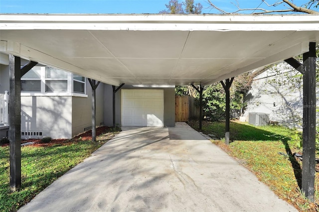 view of patio / terrace with a garage and a carport