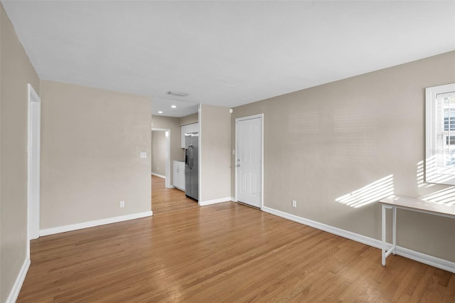 empty room featuring hardwood / wood-style flooring