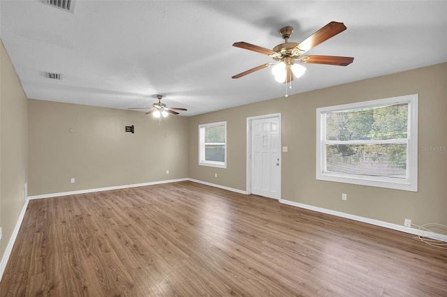 interior space with ceiling fan and wood-type flooring