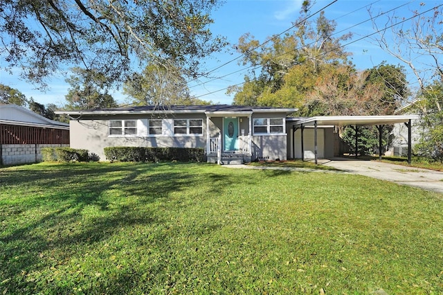 ranch-style house with a front lawn and a carport