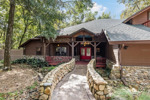 view of front of home featuring french doors and covered porch