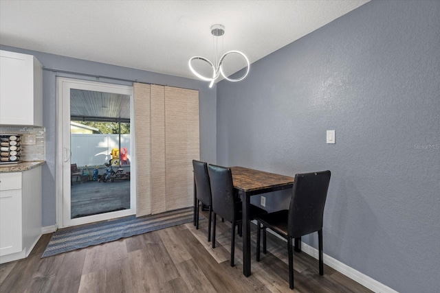 dining area with hardwood / wood-style floors