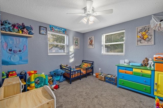 carpeted bedroom featuring ceiling fan and a textured ceiling