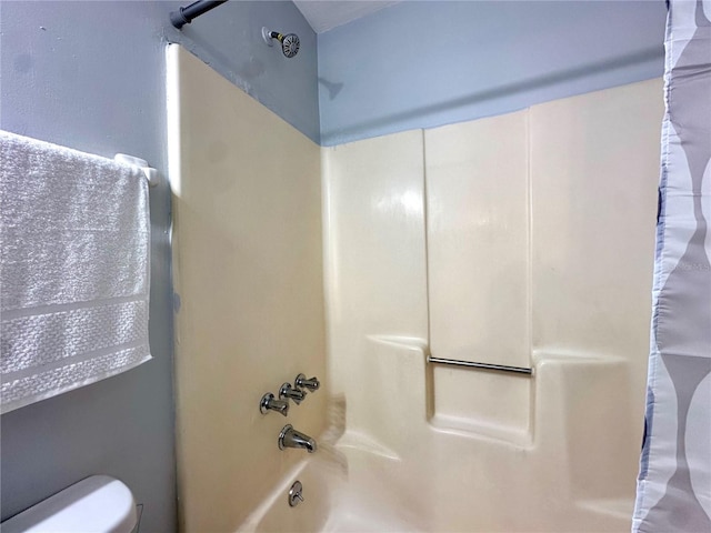 full bath featuring toilet and shower / bathtub combination with curtain