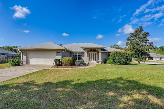 ranch-style home featuring a front lawn and a garage