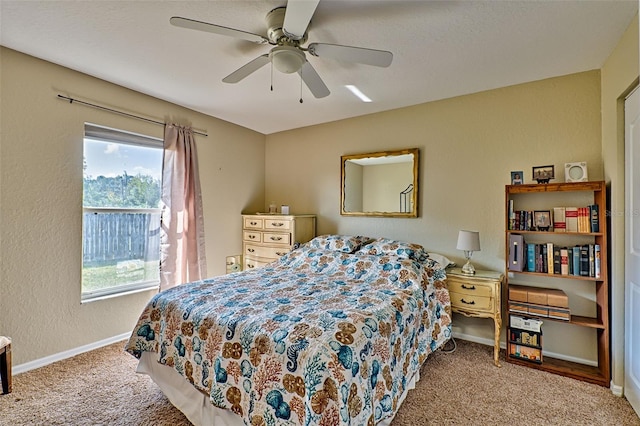 bedroom with ceiling fan and carpet