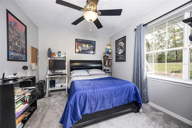 bedroom with ceiling fan and carpet floors