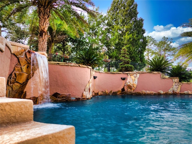 view of pool featuring pool water feature