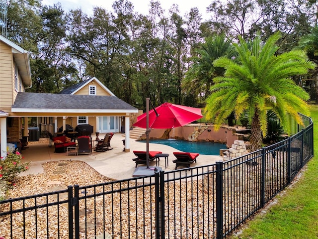 view of pool with a patio area and central AC