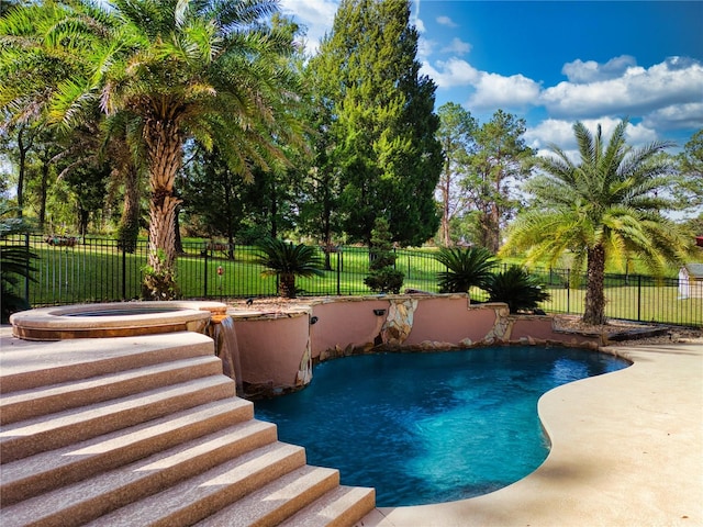 view of pool featuring an in ground hot tub