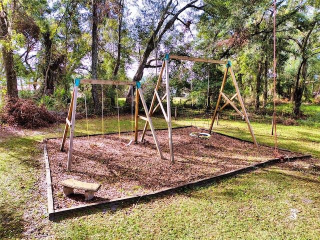 view of jungle gym with a lawn