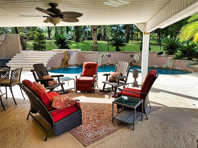 view of patio featuring pool water feature, ceiling fan, and a fenced in pool