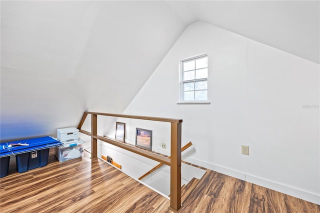 bonus room featuring hardwood / wood-style floors and lofted ceiling