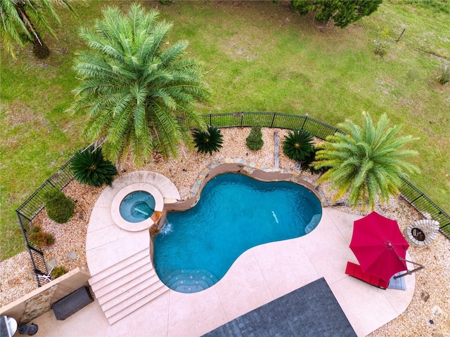 view of pool with an in ground hot tub