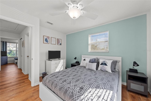 bedroom featuring ceiling fan and light wood-type flooring