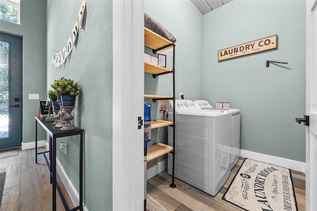 laundry area featuring hardwood / wood-style flooring and washer and clothes dryer