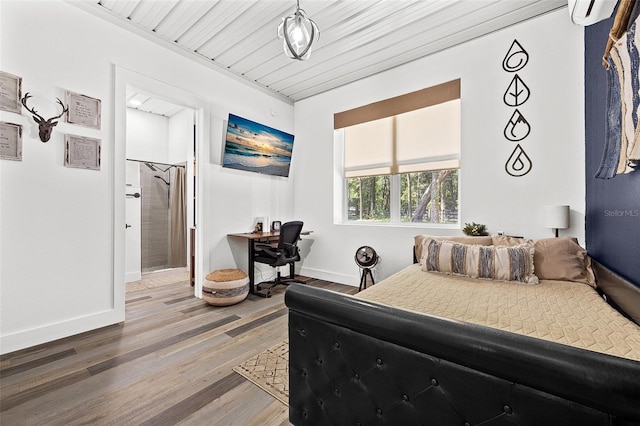 bedroom with an AC wall unit, wood ceiling, and hardwood / wood-style flooring