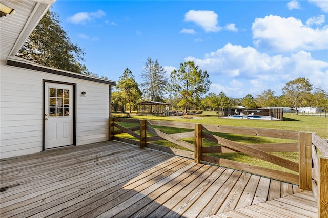 wooden deck with a lawn