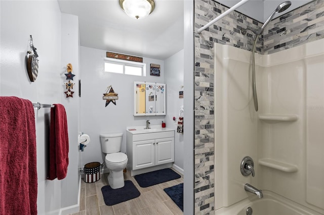 full bathroom with vanity, wood-type flooring, shower / bathtub combination, and toilet