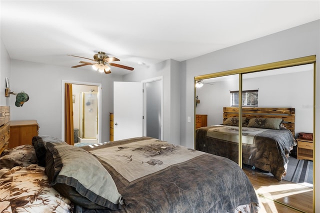 bedroom with ceiling fan, ensuite bath, light hardwood / wood-style flooring, and a closet