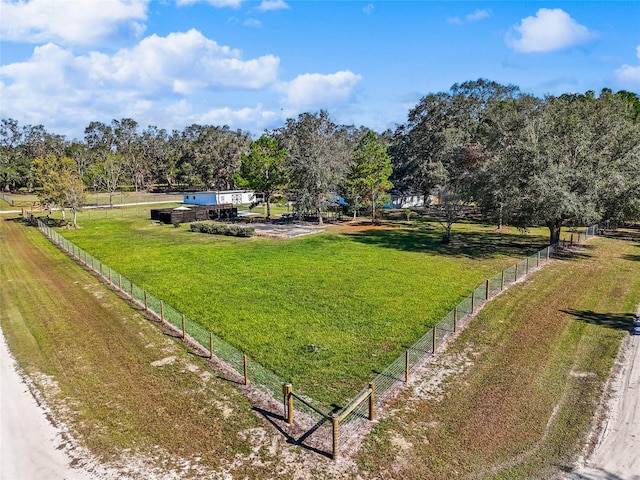 view of home's community featuring a rural view and a yard