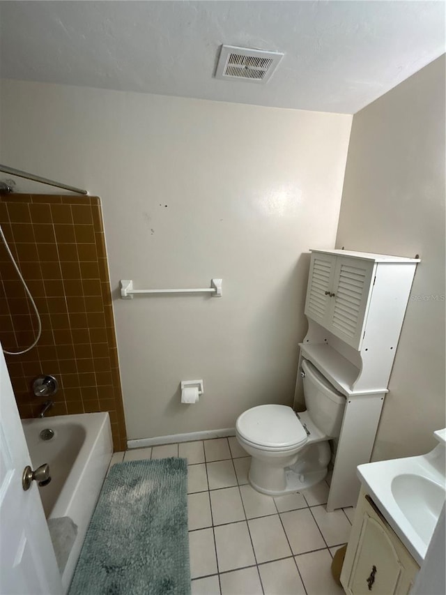 full bathroom featuring tile patterned flooring, vanity, toilet, and tiled shower / bath