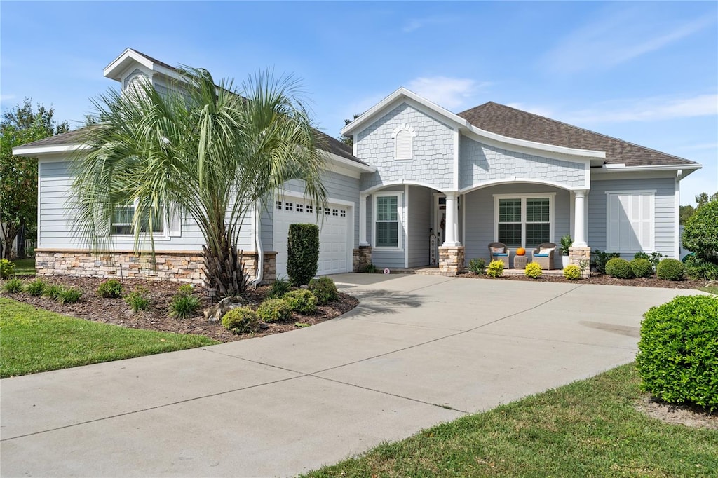 view of front of house with a porch and a garage