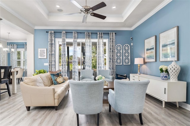 living room featuring light hardwood / wood-style floors and crown molding