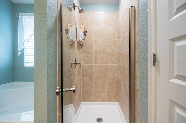 bathroom with a shower with shower door