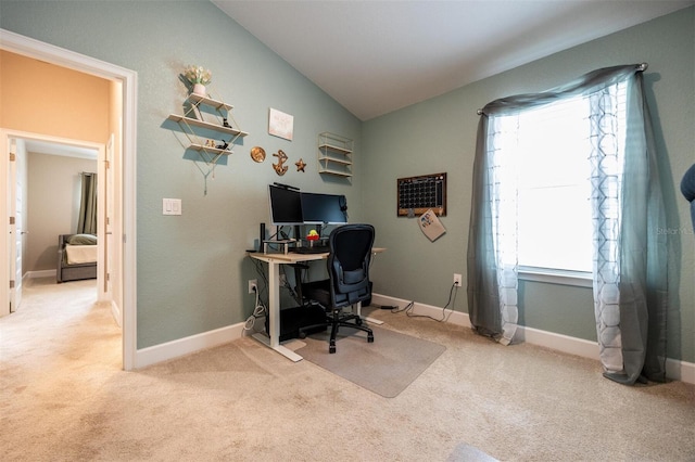 office with a wealth of natural light, light colored carpet, and lofted ceiling