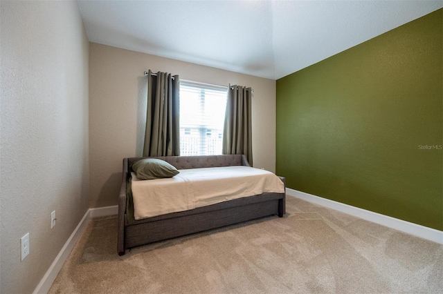 bedroom with light colored carpet