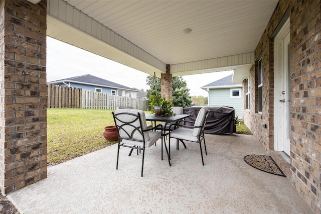 view of patio featuring a grill