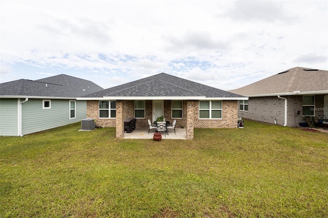 back of house with a lawn, central AC, and a patio area