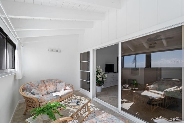 sunroom with vaulted ceiling with beams