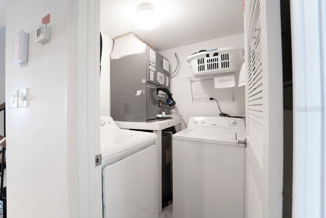 washroom with washer and dryer