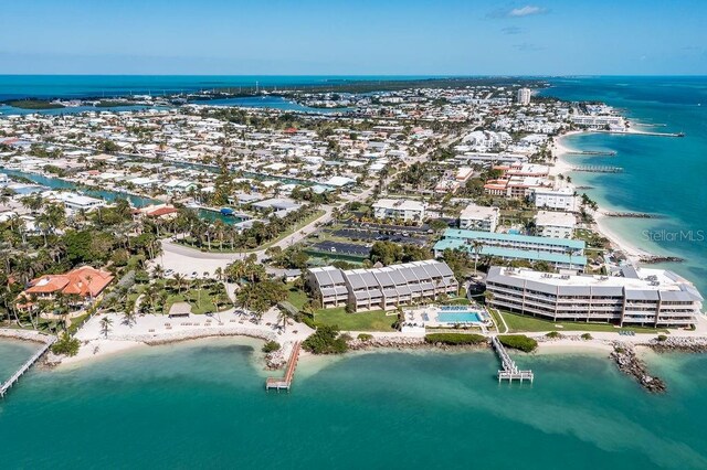 aerial view featuring a water view and a beach view