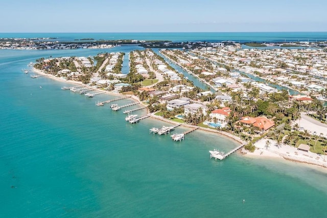 drone / aerial view featuring a water view and a view of the beach